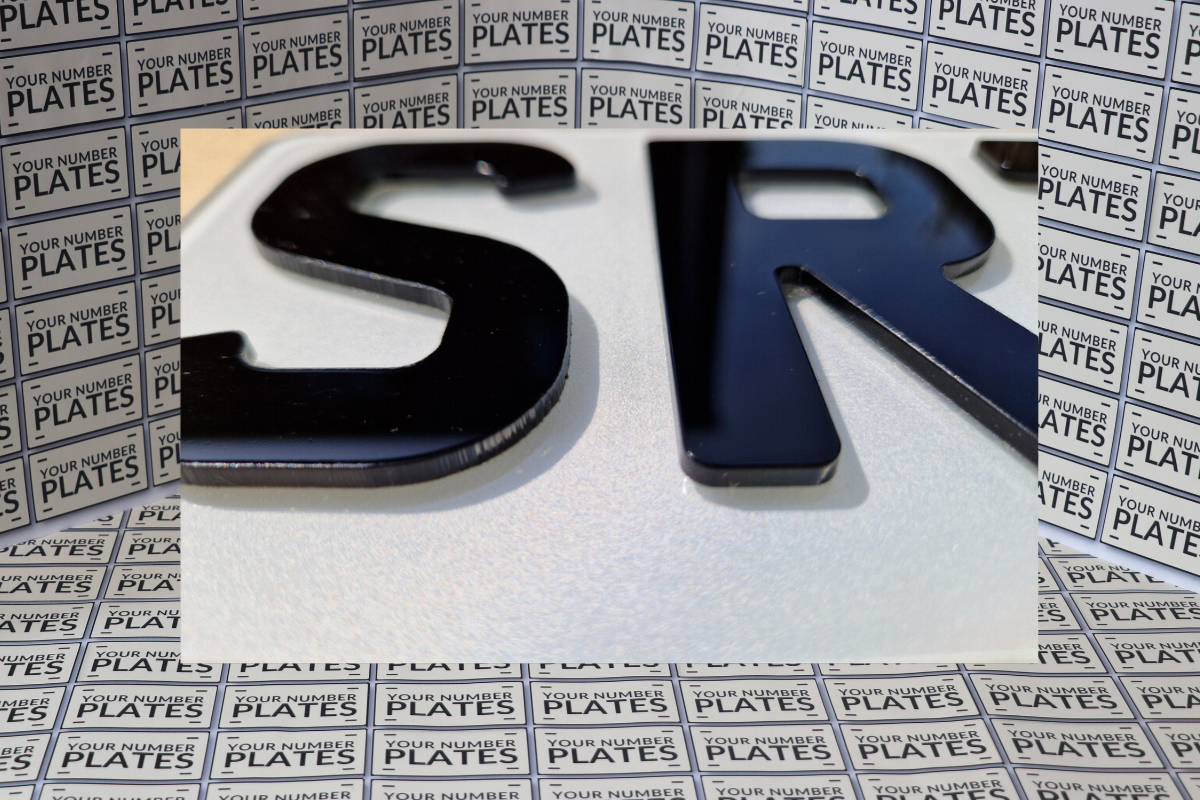 Angled view of 4D short plates 6 digit raised acrylic number plates BS AU 145e compliant