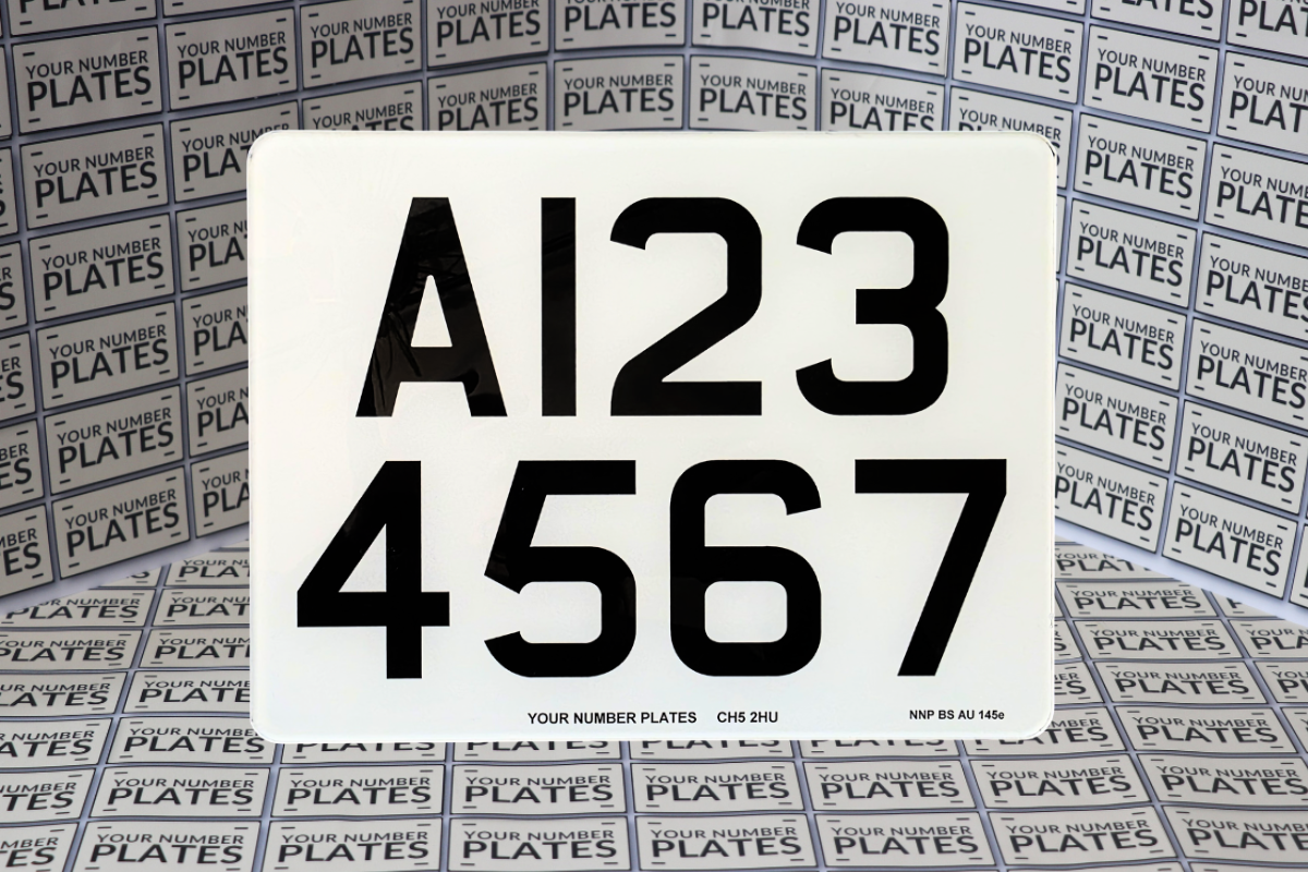 “Close-up of 9×7 inch UK trailer registration plate for European travel and international towing”