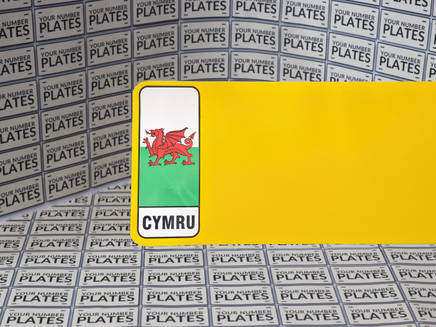 Yellow Nikkalite reflective with Welsh flag identifier for number plates