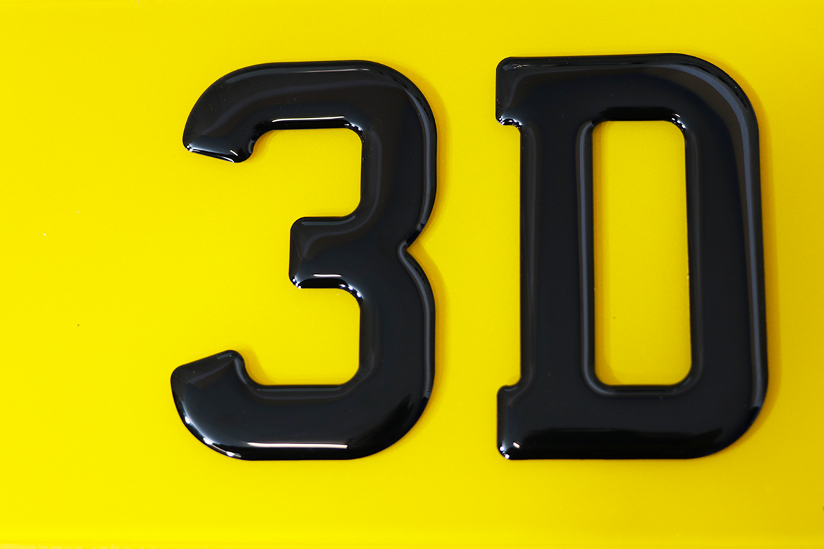 Close up of 3D gel on a yellow number plate