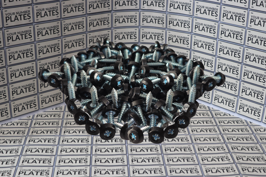 100 black polytop screws in a pile